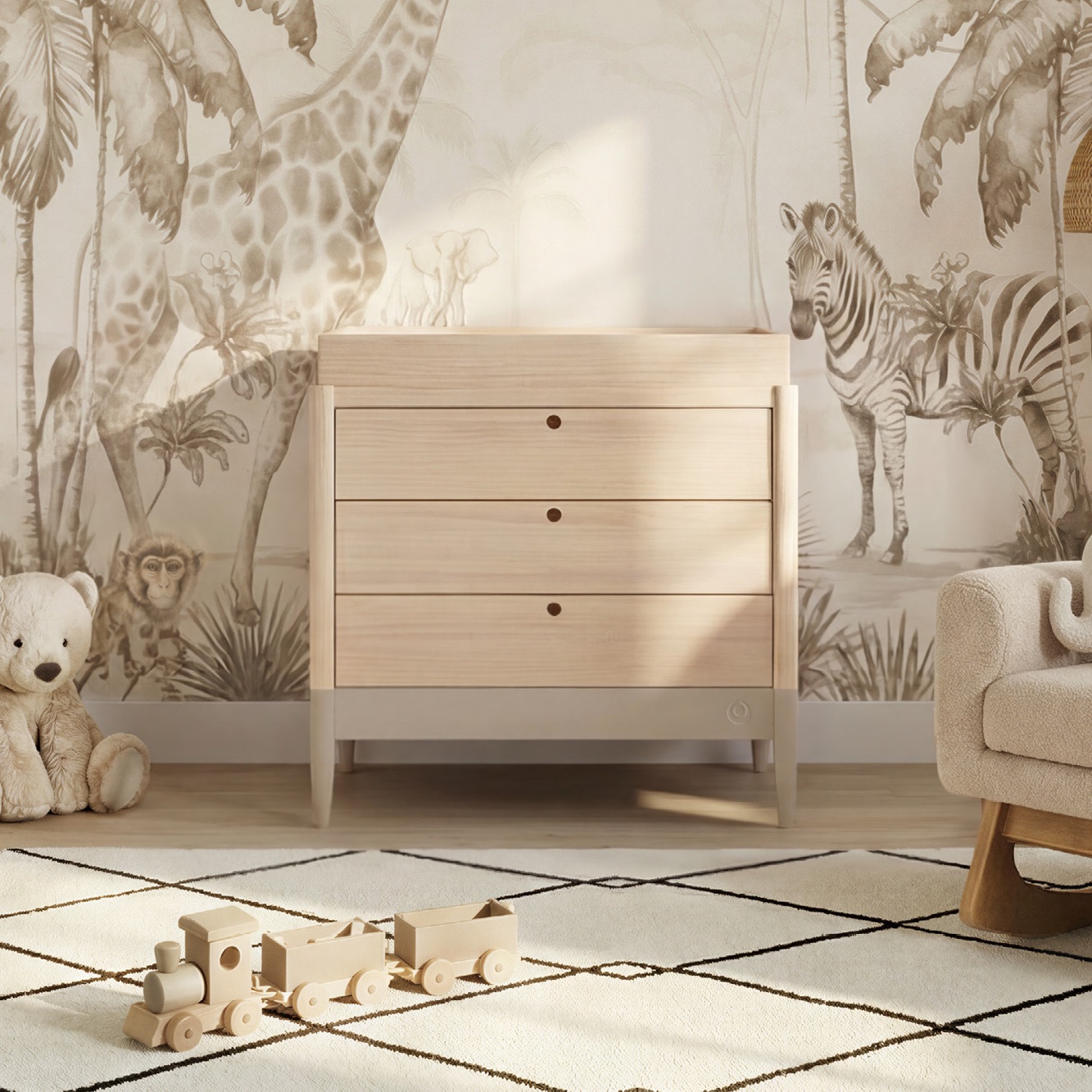 Gaia Baby Eos Dresser in natural with a changing top in a nursery with a jungle mural