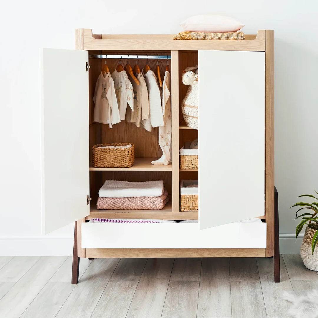Gaia Baby Hera Wardrobe with doors open showing baby clothes, baskets and folded blankets