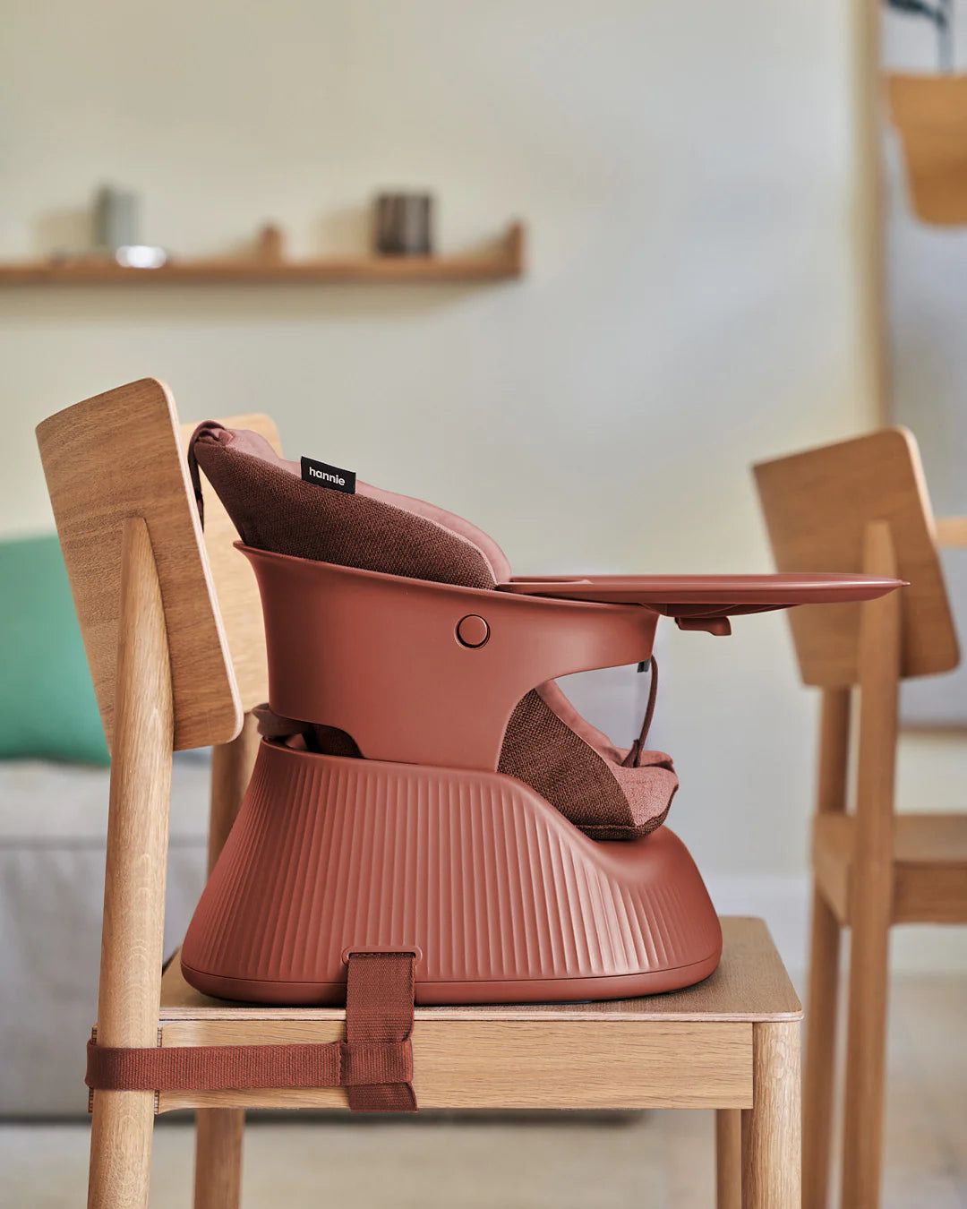 Mahogany Red Hannie with cushion and tray attached to an oak dining chair