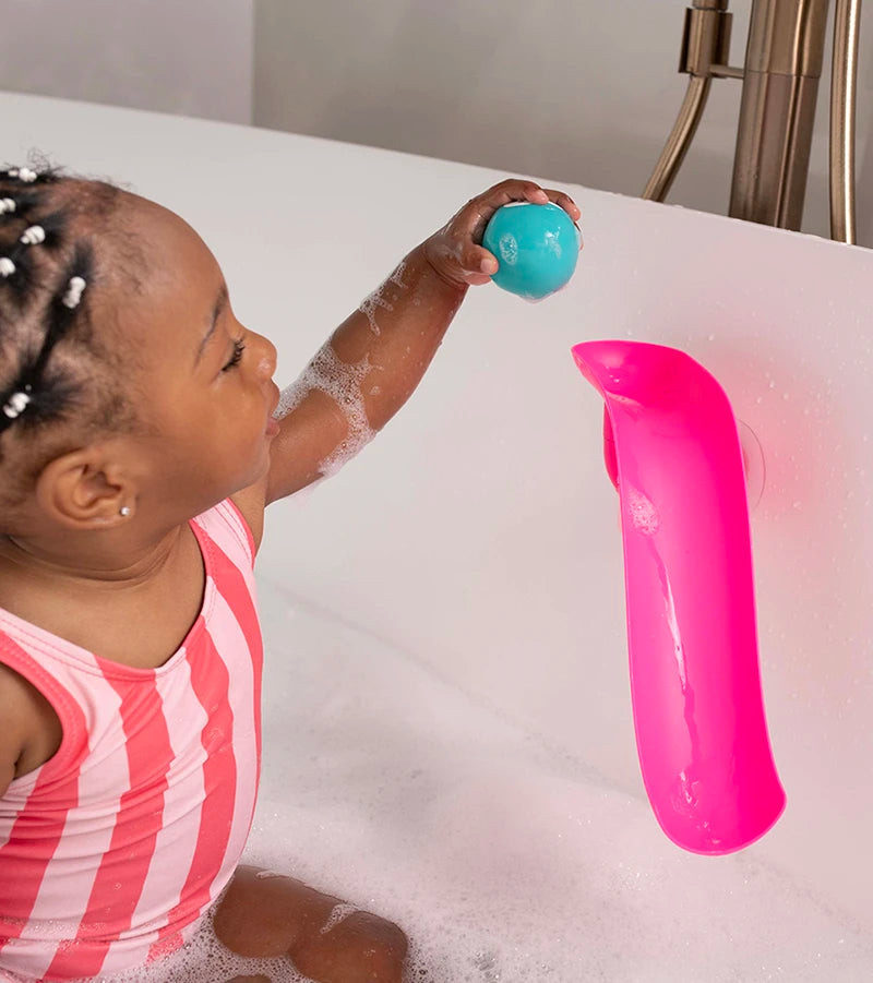 Toddler playing in a bubble bath with the Matchstick Monkey Bath Slide Set.