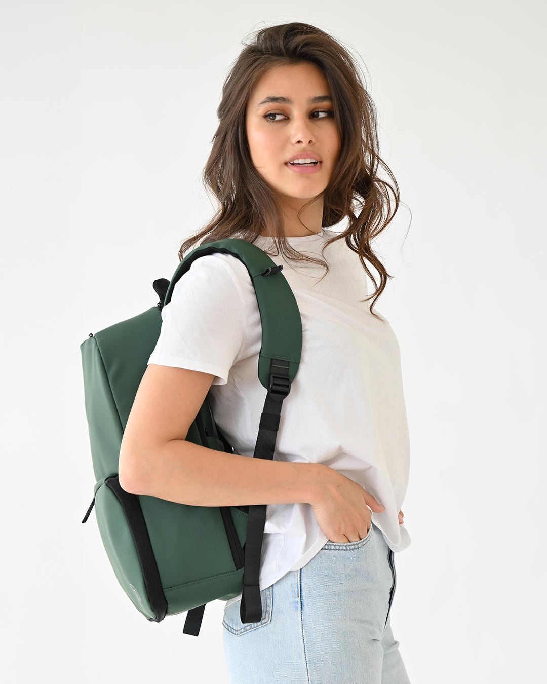 Woman wearing a Forest Green MiaMily Expandable Backpack