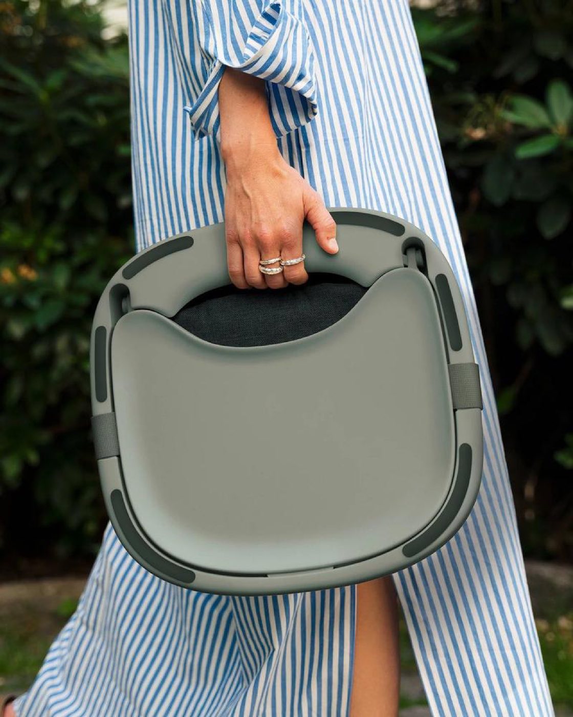 A Hannie folding seat being carried
