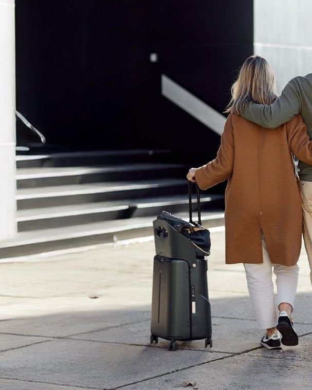 A couple walking with luggage