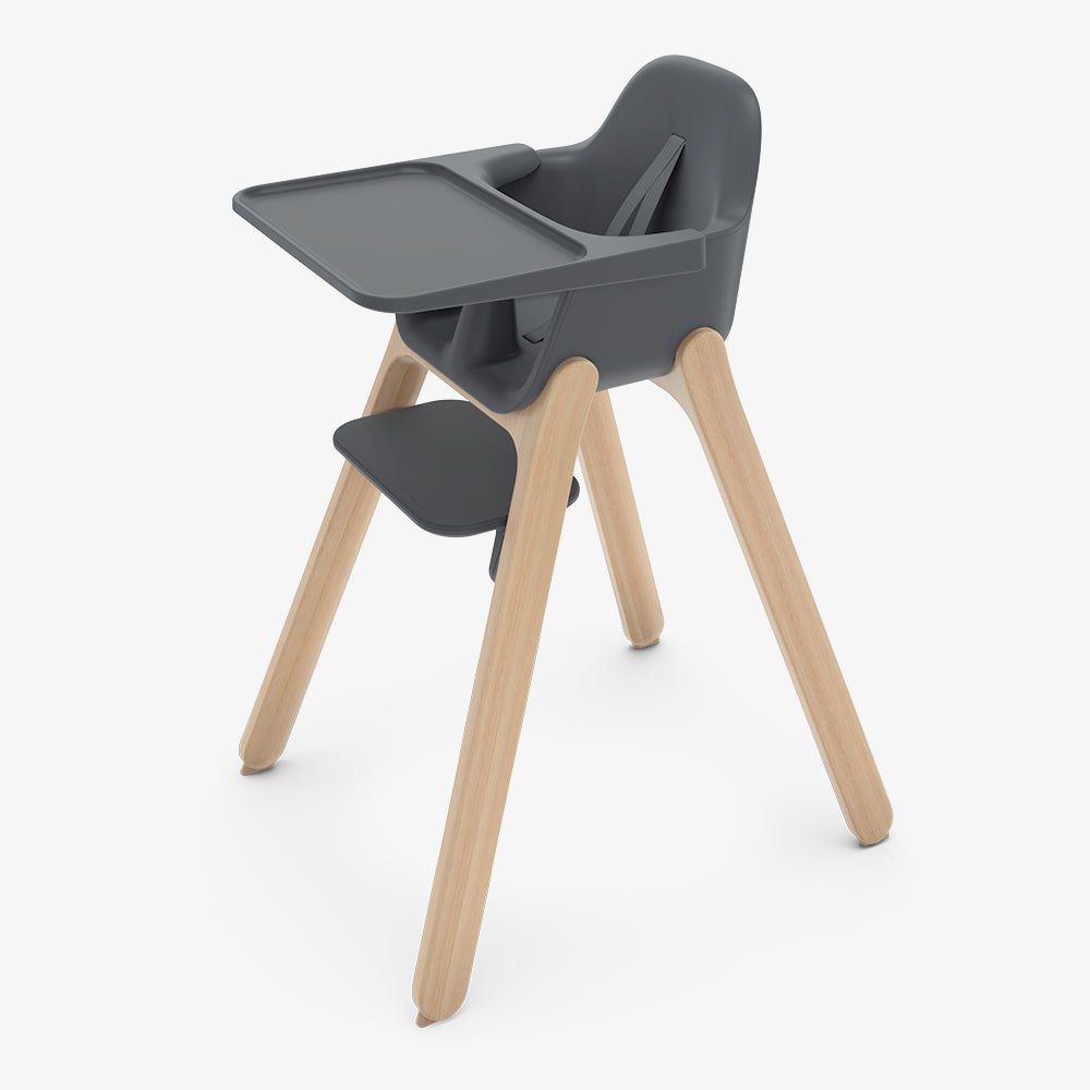 An UPPAbaby Ciro highchair in Jake charcoal with natural wood legs, tray and footrest
